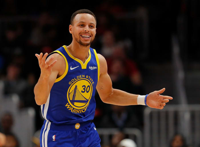 Stephen Curry reacting to getting charged with a foul.