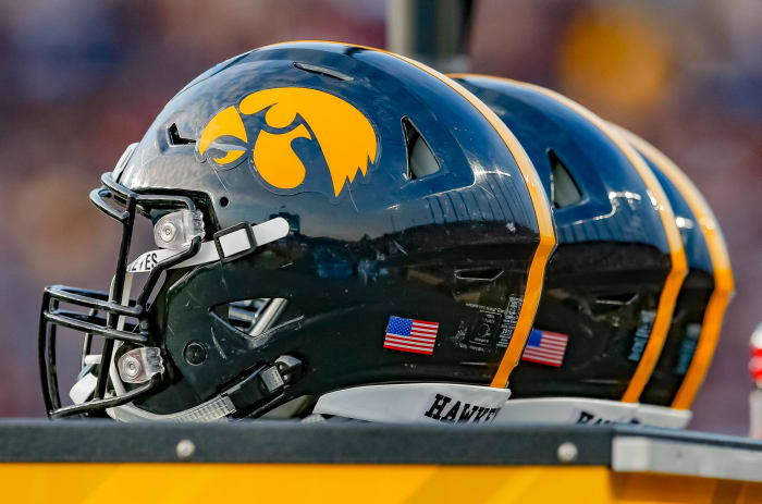 A group of Iowa Hawkeyes football helmets.