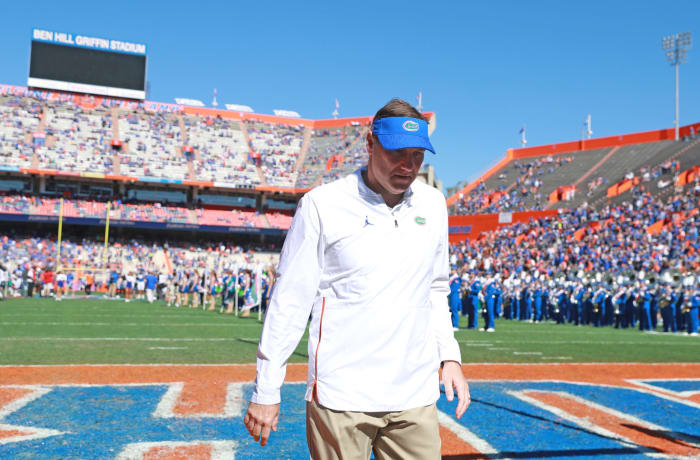 Florida football coach Dan Mullen walking off the field.
