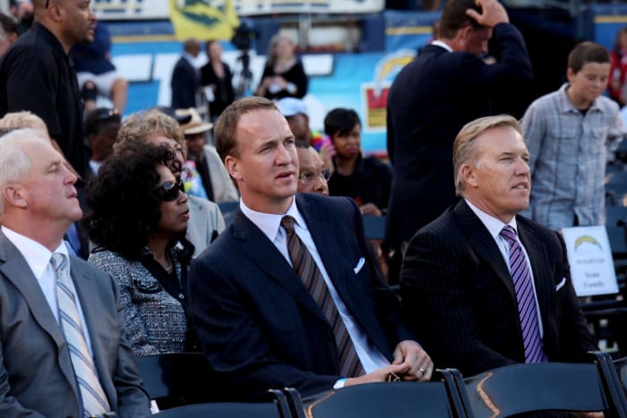 John Elway and Peyton Manning at Junior Seau's funeral.