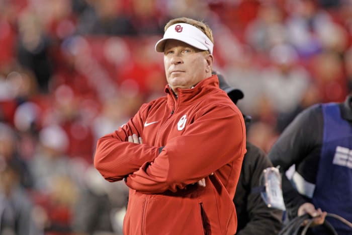 former oklahoma dc mike stoops looks onto the field