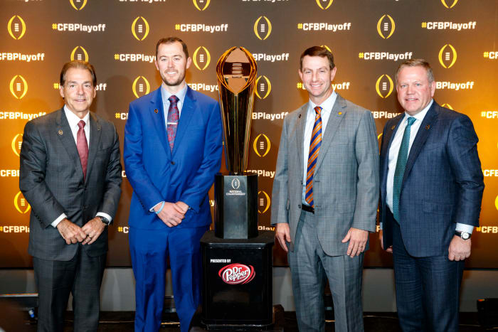 Dabo Swinney, Nick Saban, Lincoln Riley and Brian Kelly with the College Football Playoff trophy.