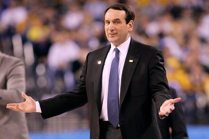 Coach K gestures as he coaches a Duke college basketball game.