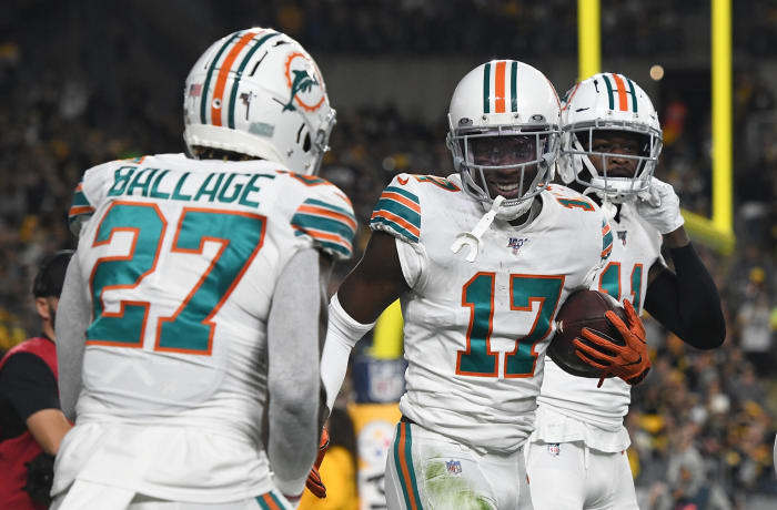 Miami Dolphins players celebrate a touchdown.