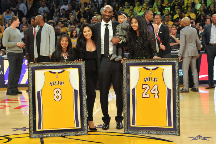 Kobe Bryant and Vanessa Bryant with their children at the Staples Center.