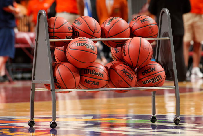 A rack of NCAA basketballs.