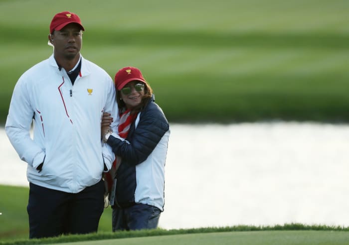 tiger woods and his girlfriend on the golf course