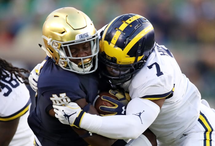 Michigan's Khaleke Hudson lays a hit on Notre Dame RB/WR Jafar Armstrong.