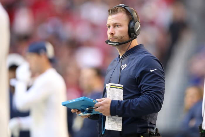 Rams caoch Sean McVay holding an IPad during a game.