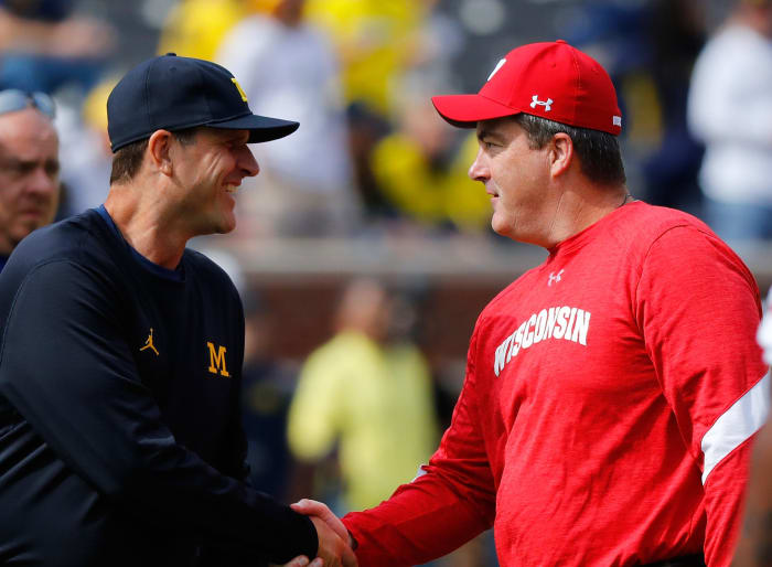 Jim Harbaugh and Paul Chryst shaking hands after a Michigan vs. Wisconsin game.