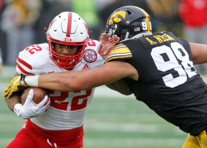 Nebraska RB Devine Ozigbo runs through an Iowa defender.