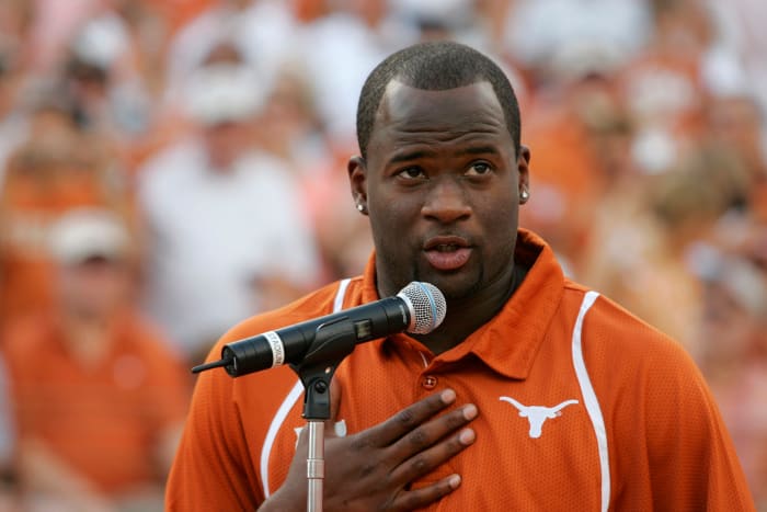 Vince Young speaking into a microphone during a Texas Longhorns game.
