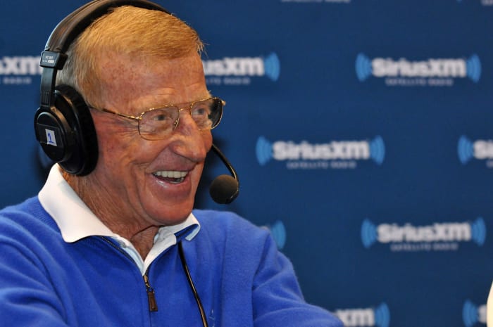 A closeup of Lou Holtz speaking to the media.