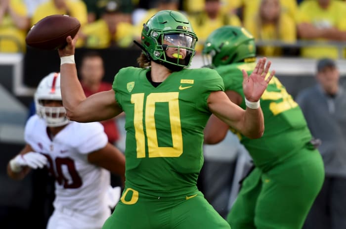Justin Herbert of the Oregon Ducks attempts a pass.