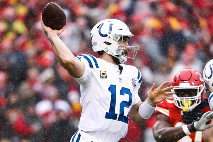 Indianapolis Colts QB Andrew Luck throwing a pass in the snow.