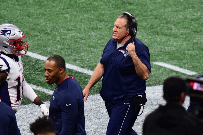 bill belichick walks the sideline during the super bowl