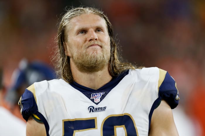 Clay Matthews stands on the sideline.