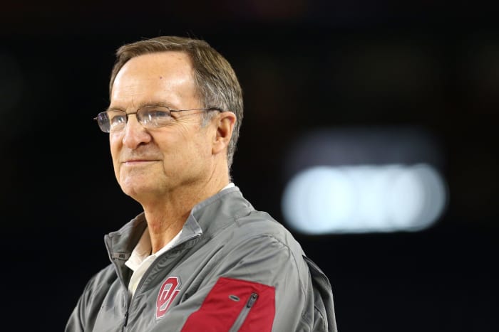 A closeup of Lon Kruger in an Oklahoma basketball windbreaker.