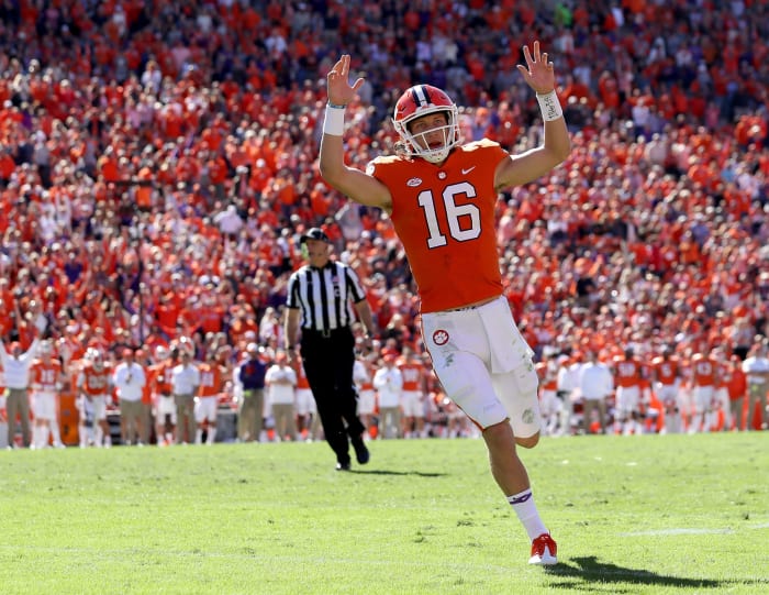 trevor lawrence celebrates a touchdown against louisville