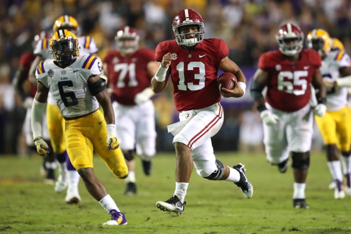 alabama quarterback tua tagovailoa runs for a touchdown vs. lsu during a college football matchup.