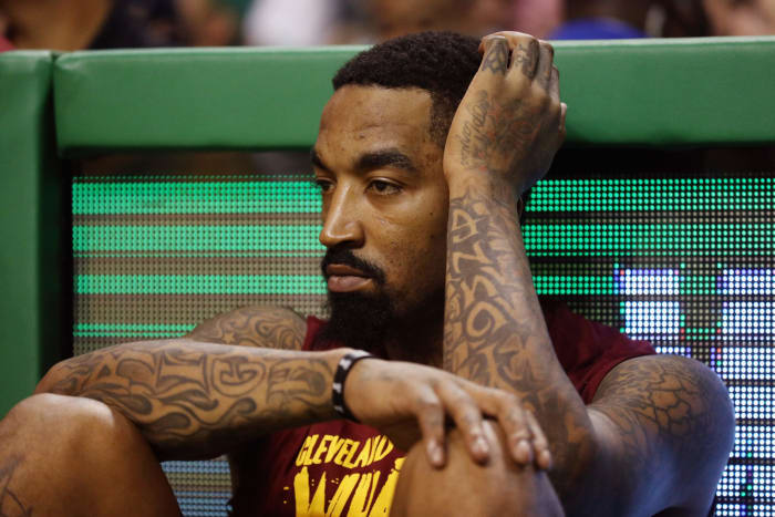J.R. Smith waits to come into an NBA game.