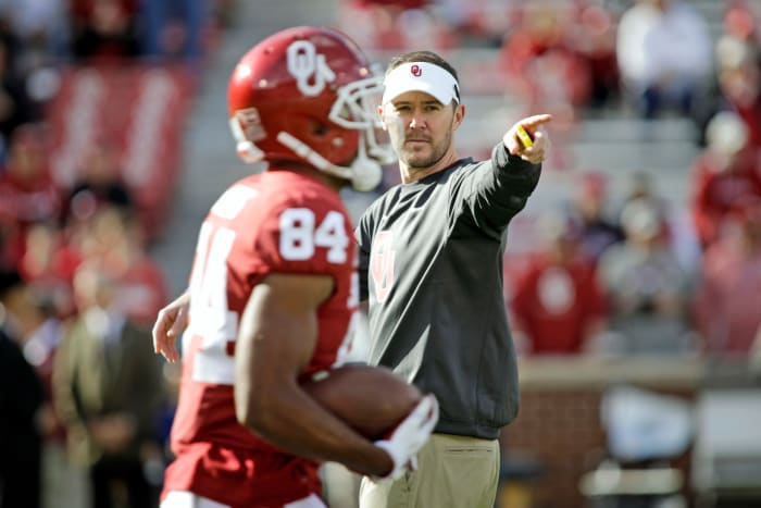 Oklahoma directing players during pregame warmups.