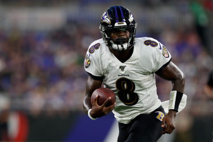 Lamar Jackson scrambles in preseason game for Ravens.