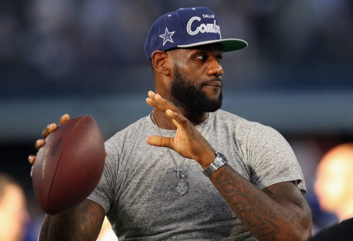 LeBron James throws a pass before a Cowboys game.