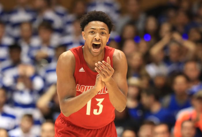 Louisville guard David Johnson claps.