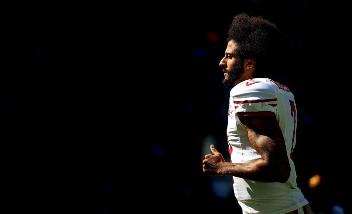 colin kaepernick runs onto the field during an nfl game
