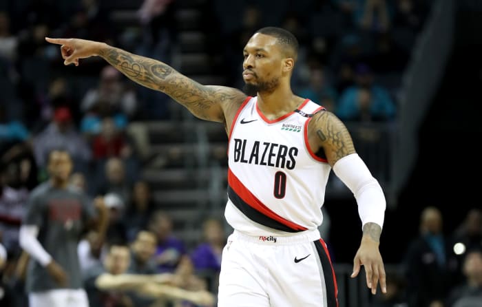 Damian Lillard pointing during a game.