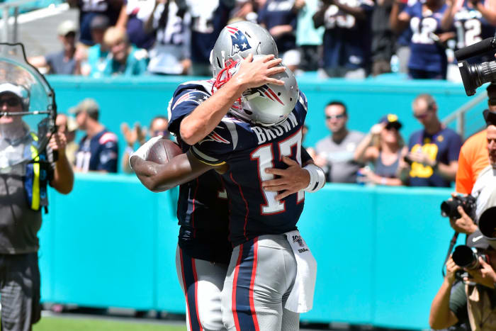 Antonio Brown and Tom Brady celebrate a Patriots touchdown.