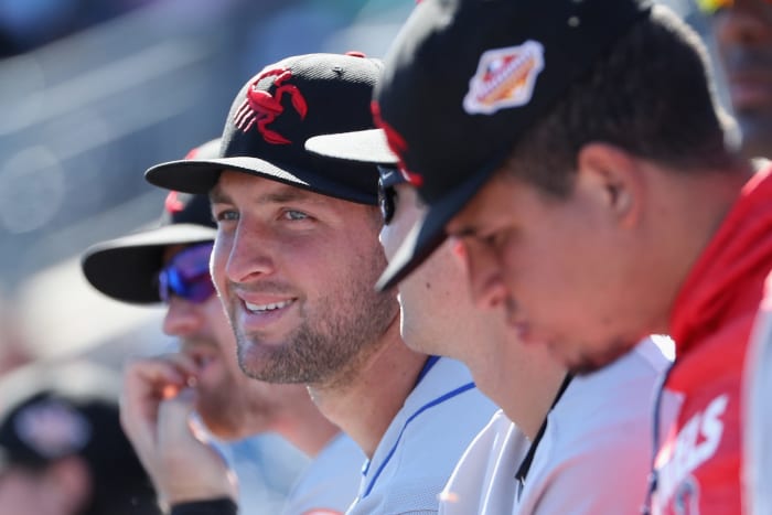 Tim Tebow in a Minor League baseball cap.
