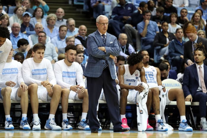 Roy Williams stands in front of the North Carolina bench during a loss vs. Clemson.