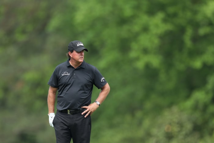 Phil Mickelson standing on the green at The Masters, one of four PGA majors..
