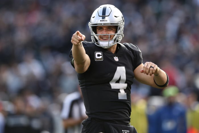 A closeup of Las Vegas Raiders QB Derek Carr pointing with one finger during a game against the Kansas City Chiefs.