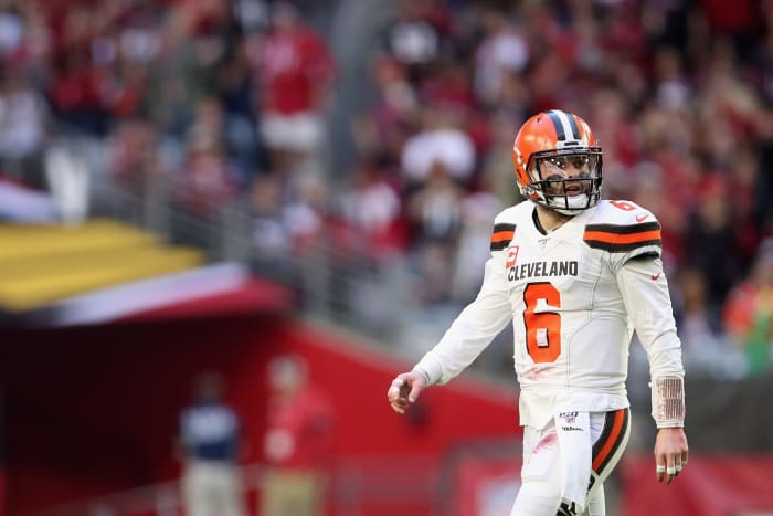 Baker Mayfield walks off the field after Cleveland Browns loss to the Cardinals.