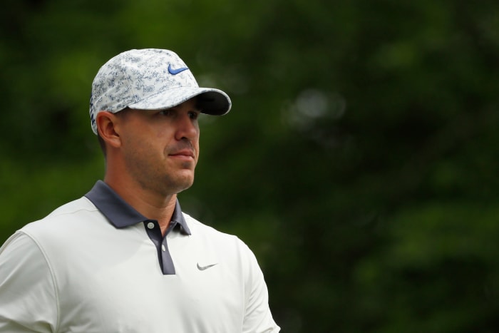 A closeup of Brooks Koepka on the golf course.