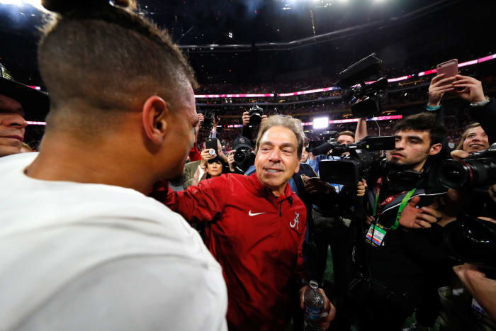 Head coach Nick Saban of the Alabama Crimson Tide celebrates with Tua Tagovailoa #13 after beating the Georgia Bulldogs.