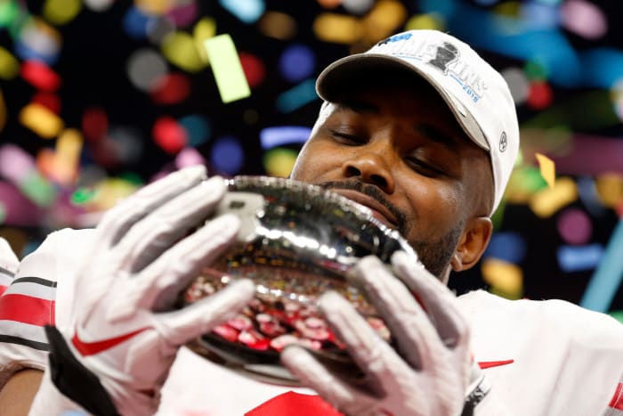 K.J. Hill of Ohio State celebrates with Big Ten Championship Trophy.