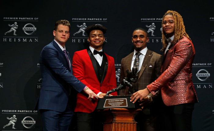 The 2019 Heisman Trophy finalists including Justin Fields with the trophy.