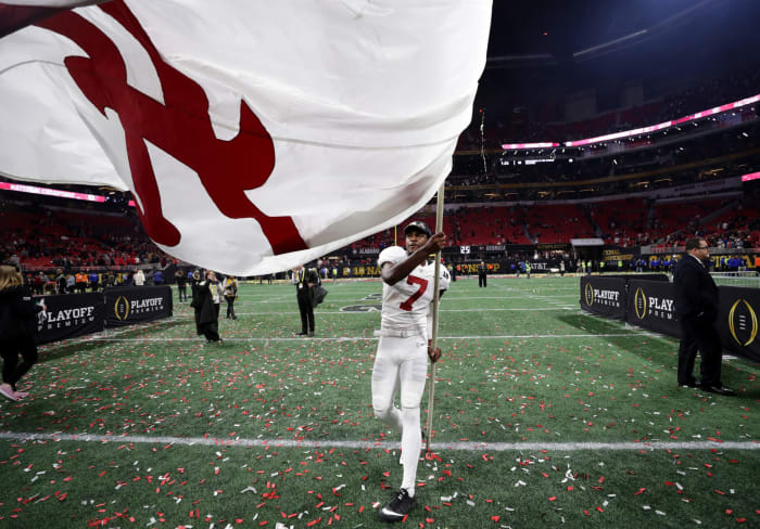 Trevon Diggs waving an Alabama flag.
