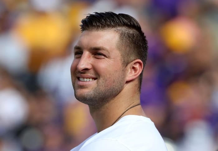 Tim Tebow on the field before a game.