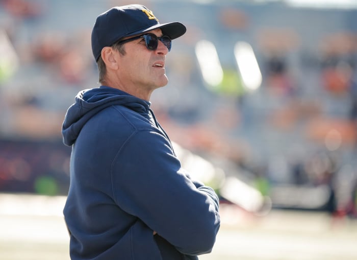Michigan football head coach Jim Harbaugh coaching against Illinois.