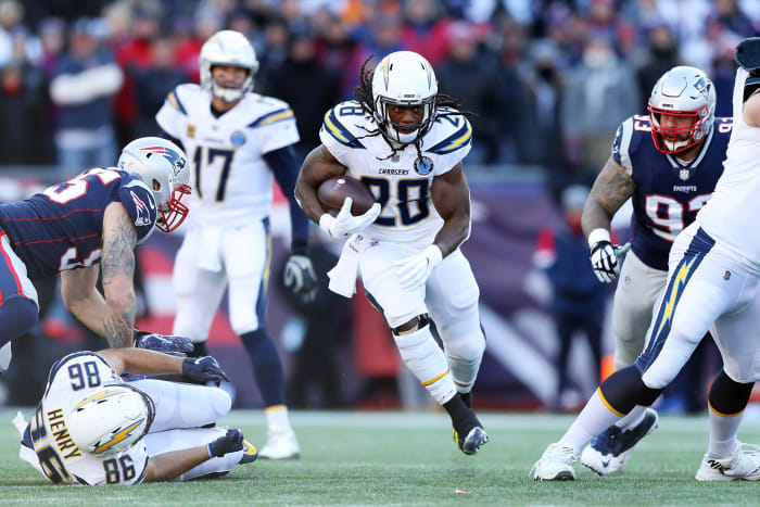 Melvin Gordon runs with the ball for the Chargers against the Patriots.