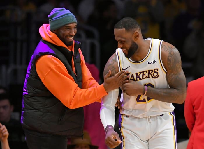LeBron James and Kobe Bryant address each other before a Lakers game.
