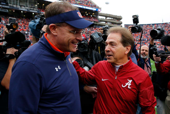 Gus Malzahn and Nick Saban talk after an Alabama vs. Auburn Iron Bowl game.