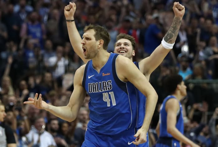 Dirk Nowitzki celebrating with Luka Doncic.