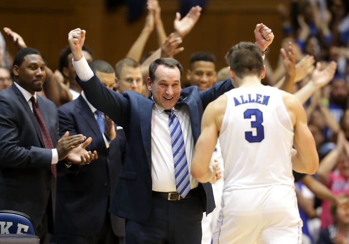 Coach K celebrates a win with Grayson Allen.
