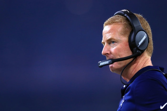 Jason Garrett stands on the sideline.